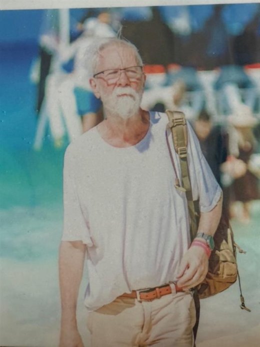 On the beach with a backpack, explorer style