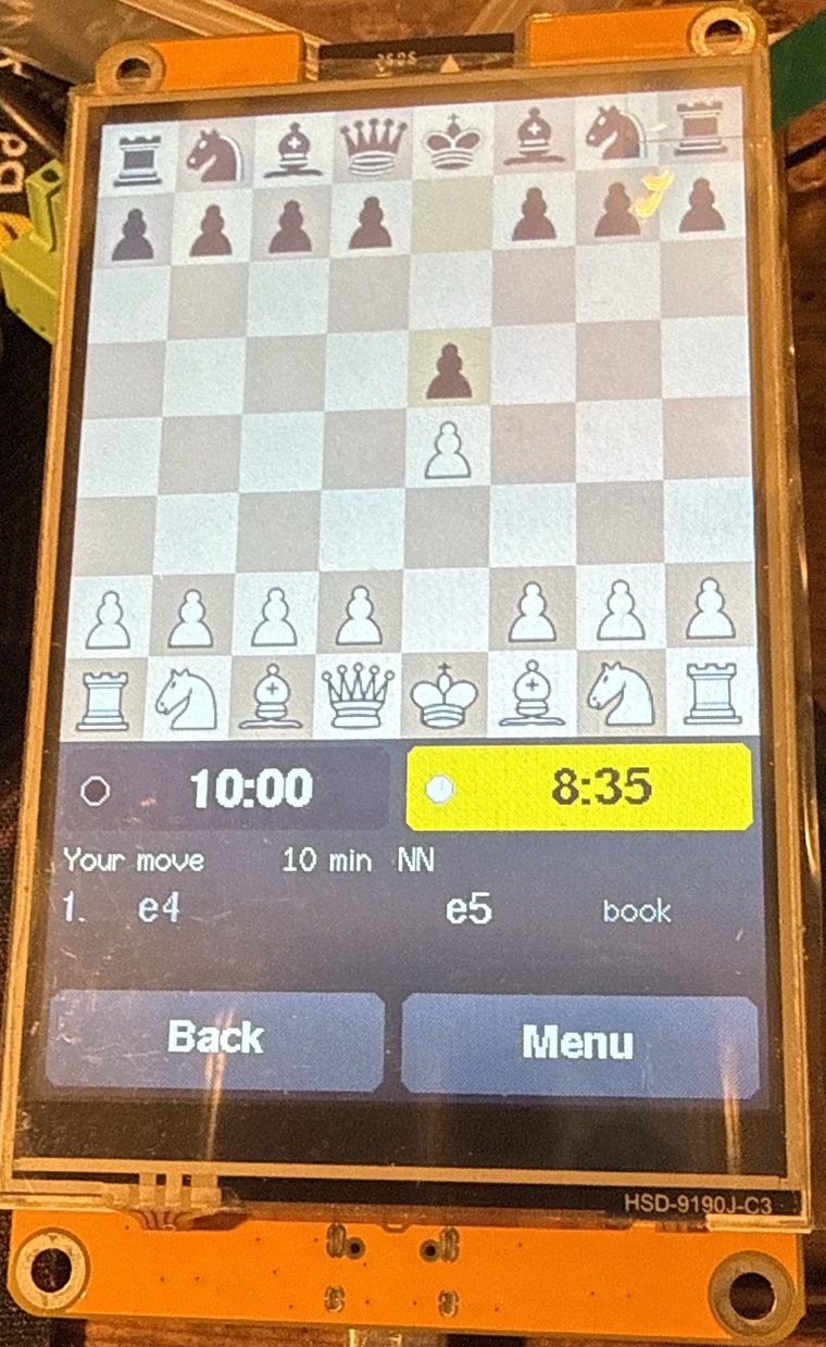 The 4-inch ESP32-32E display in portrait, one move into a game: the board on top, two clocks side by side, the move list and the Back and Menu buttons